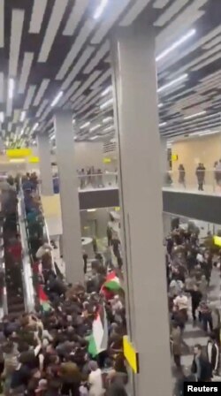 A still from video footage shows pro-Palestinian protesters storming the airport building in Makhachkala on October 29.