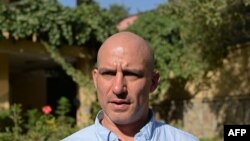 New York Times correspondent Matthew Rosenberg speaks during an interview with an AFP reporter at the New York Times office in Kabul, August 20, 2014.