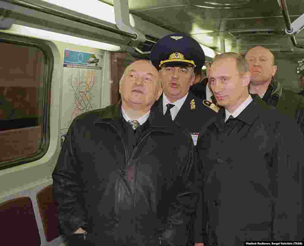 Russia President Vladimir Putin (right) and Luzhkov inspect a train while visiting a new metro station in southern Moscow on December 12, 2001.