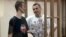 Oleksandr Kolchenko (left) hoped that his former co-defendant, Oleh Sentsov (right), who is also on hunger strike in a Russian prison, wouldn't be "angry" with him.