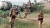 Russia -- Russian special forces enter a Chechen village. May 1996