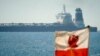 A view of the Grace 1 super tanker in the British territory of Gibraltar, Thursday, July 4, 2019. (AP Photo/Marcos Moreno)