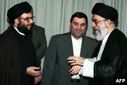 Iranian Supreme Leader Ayatollah Ali Khamenei (right) greets Hezbollah Secretary-General Hassan Nasrallah (left) at his office in Tehran in July 2000.