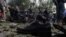 A victim's shoe lies on the ground as police secure the site of a suicide attack in Kabul in June.