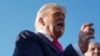 US President Donald Trump speaks with the media at Joint Base Andrews.