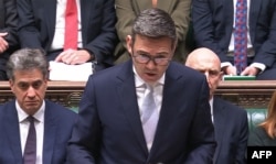 UK Prime Minister Andy Burnham addresses the House of Commons on October 12.
