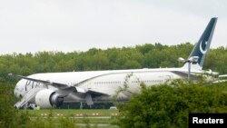 A Pakistan International Airlines Boeing 777 aircraft is seen parked on the tarmac at Stansted Airport on May 24.