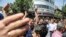 IRAN -- A group of protesters chant slogans at the main gate of old grand bazaar in Tehran, Iran, Monday, June 25, 2018. Protesters in the Iranian capital swarmed its historic Grand Bazaar on Monday, news agencies reported, and forced shopkeepers to close