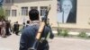 Afghanistan -- Afghan civilians show arms