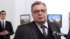 Russian Ambassador to Turkey Andrei Karlov moments before Mevlut Mert Altintas (background left) opened fire and killed him in Ankara on December 19, 2016