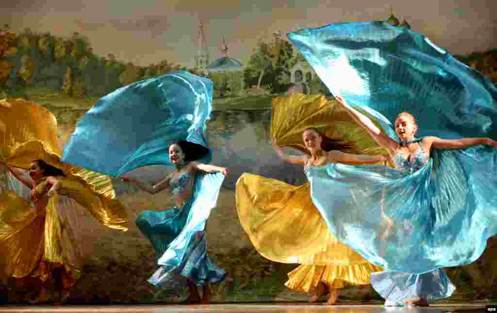 Russian girls dancing at a concert dedicated to the Day of Russia at the Kant air base in Kyrgyzstan on June 12. (epa/Igor Kovalenko)