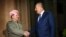 The president of Iraq's Kurdish autonomous region, Masud Barzani (left), meets with Turkish Foreign Minister Mevlut Cavusoglu in Irbil on August 23.