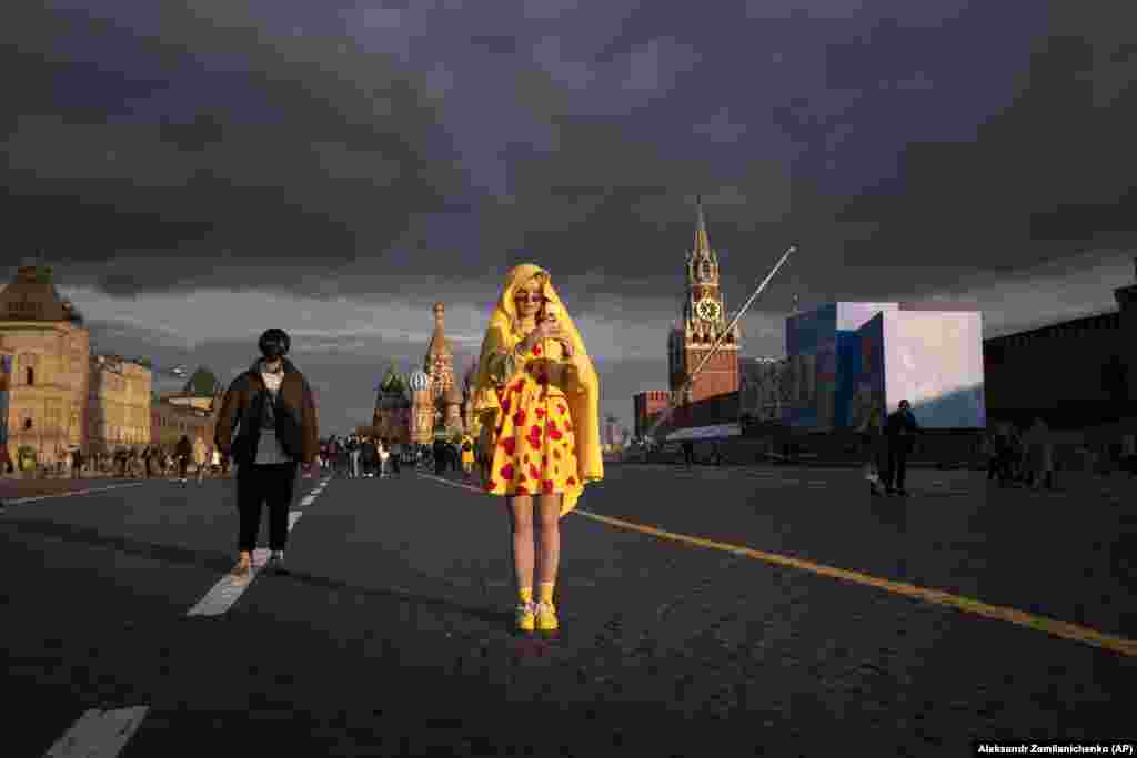 A young woman poses for a selfie on Red Square in Moscow, which is being prepared for a Victory Day Parade. Russia will celebrate 76 years since victory over Nazi Germany in World War II on May 9. (AP/Alexander Zemlianichenko)