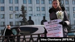 A protester stands outside the Defense Ministry in Moscow on March 8.