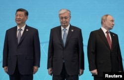 Chinese President Xi Jinping, Toqaev, and Putin (left to right) at the Shanghai Cooperation Organization summit in Astana on July 4.