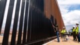 US says entire southern border wall with Mexico to be painted black to deter migrants