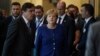 BELGIUM -- Germany's Chancellor Angela Merkel (C) gestures as she arrives ahead of a summit at EU headquarters in Brussels on June 24, 2018.