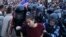 Russian police detain a protester at an unauthorized opposition rally in central Moscow on June 12.