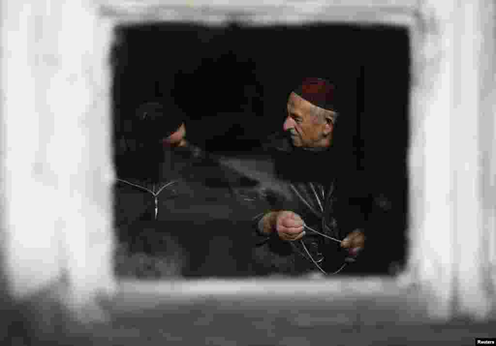 Men pray inside a mosque in the village of Duisi in the Pankisi Gorge, Georgia. (Reuters/David Mdzinarishvili)