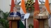 Kyrgyz President Almazbek Atambaev (left) and Indian Prime Minister Narendra Modi in New Delhi on December 20