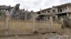 This picture taken on March 26 shows a view of a damaged building following an air strike in Syria's eastern city of Deir al-Zor.