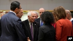 EU High Representative for Foreign Affairs and Security Policy Josep Borrell (third left) speaks with a group of EU foreign ministers in Brussels, November 13, 2023. 