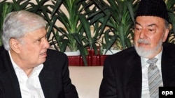 Former Pakistani Interior Minister Aftab Khan Sherpao (left) is seen at a 2007 meeting with Afghan Regional Peace Jirga Preparation Commission to Pakistan head Pir Said Ahmad Gilani.