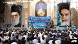 Supreme Leader Ayatollah Ali Khamenei delivers a speech on the 24th anniversary of the death of the late founder of the Islamic Republic Ayatollah Ruhollah Khomeini (pictured right) at his mausoleum in a suburb of Tehran on June 4.