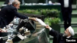 Iranian president Hassan Rouhani in the parliament with Ali Larijani