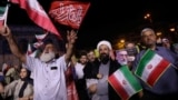 Pro-government demonstrators in Tehran celebrate Iran’s June 13 air strike on Israel. While such scenes are genuine, RFE/RL has found that Iranian state media has also circulated unrelated or outdated visuals to support its narrative of the conflict.