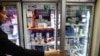 A pharmaceutical worker works in a pharmacy in Tehran
