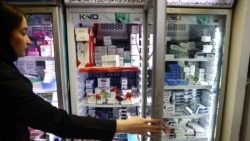A pharmacist works at a pharmacy in Tehran on April 23.