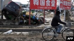 Ճապոնիա - Կրկնակի աղետից տուժած բնակավայրերից մեկի փողոցներում, 13-ը մարտի, 2011թ.