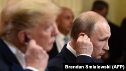 Дональд Трамп и Владимир Путин на совместной пресс-конференции 16 июля 2018 года.