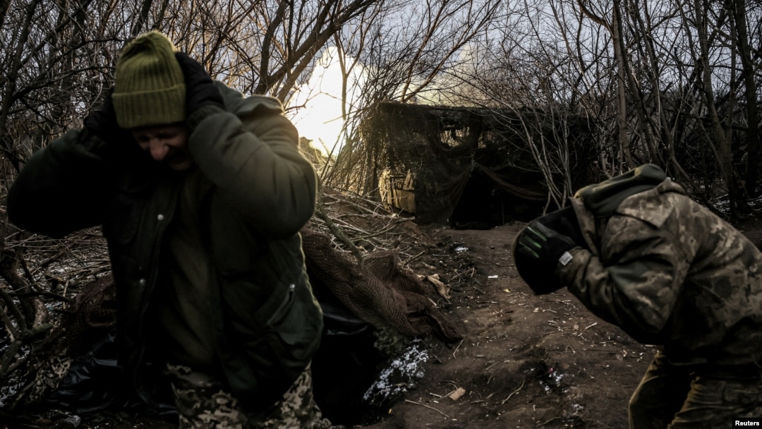 Ukrainian soldiers fire a self-propelled howitzer toward Russian troops at a frontline near the town of Chasiv Yar, Donetsk region, in January.