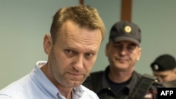 Aleksei Navalny arrives for a hearing at a court in Moscow on June 16.