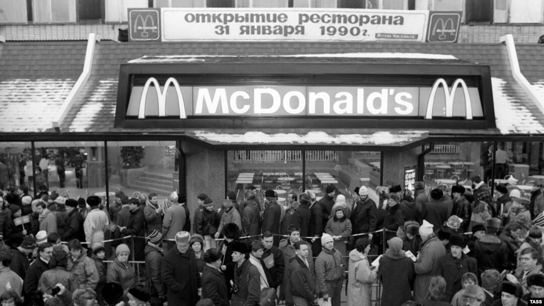 People stand in line near the entrance to the first McDonalds in Moscow, 31 January 1990.