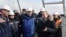 Russian President Vladimir Putin (second right) inspects a completed section of a bridge over the Kerch Strait that is meant to link Crimea to Russia. 