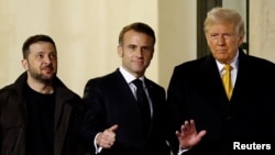 French President Emmanuel Macron (center) meets with U.S. President-elect Donald Trump (right) and Ukrainian President Zelenskiy in Paris on December 7.