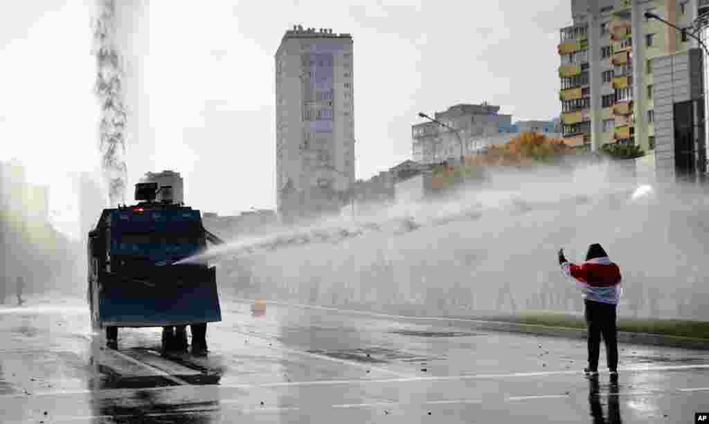 Police use a water cannon against demonstrators during a rally in Minsk, Belarus. Hundreds of thousands of Belarusians have been protesting daily since the August 9 presidential election. (AP)