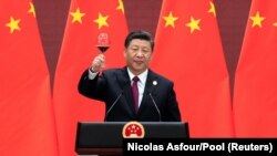 Chinese President Xi Jinping raises his glass and proposes a toast at the welcome banquet of the Belt and Road Forum at the Great Hall of the People in Beijing in April 2019.