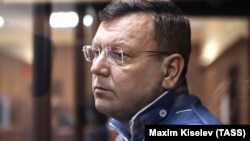 The director of the Listvyazhnaya coal mine, Sergei Makhrakov, seen inside a defendant's cage in a courtroom in Kemerovo on November 27, is accused of violating industrial safety rules that led to the deaths of the miners.