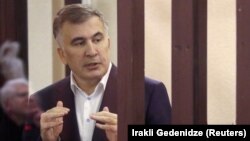 Georgian ex-President Mikheil Saakashvili delivers a speech in the defendant's dock during a court hearing in Tbilisi on December 2.