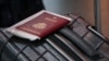 A passport and a suitcase are pictured at Vnukovo International Airport.