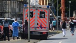 An ambulance is parked outside the residences of the Toennies workers under quarantine on June 22.