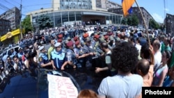 Armenia -- Dozens of people demonstrate in Yerevan as the Public Services Regulatory Commission formally raises electricity prices by 10 percent, 1Jul2014.