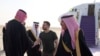 Ukrainian President Volodymyr Zelenskiy is welcomed upon arriving at an airport in an unknown location in Saudi Arabia on February 27.