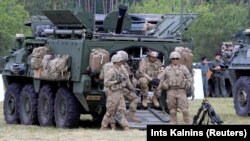 U.S. soldiers take a break during NATO's Saber Strike exercises in Poland in 2017.