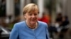 Меркель залишається виконувачкою обов’язків канцлера до того, як наступного тижня складе присягу її наступник, соціал-демократ Олаф Шольц