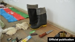 Nagorno-Karabakh - Weapons, ammunition and an Azerbaijani flag which the Karabakh Armenian military says were confiscated from an arrested member of an Azerbaijani commando unit, 10Jul2014.